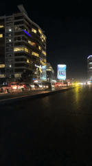 Dar es Salaam streets at night, wet roads and city lights
