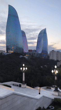 Dusk panorama captures illuminated Baku skyline and Flame Towers