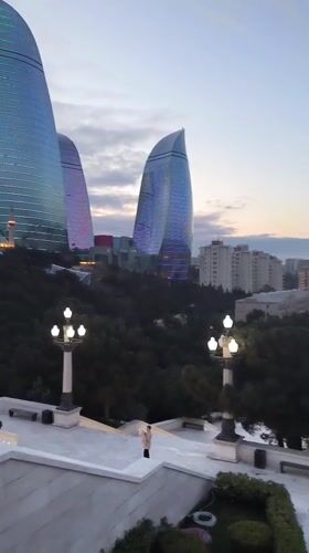 Dusk panorama captures illuminated Baku skyline and Flame Towers