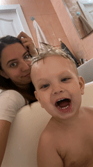 Mother and child share bath time moment in Sevastopol