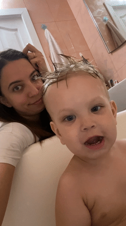 Mother and child share bath time moment in Sevastopol