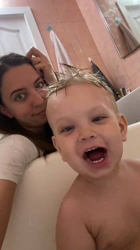 Mother and child share bath time moment in Sevastopol