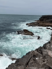Powerful waves crash against rugged Cascais coastline