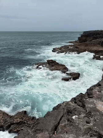Powerful waves crash against rugged Cascais coastline