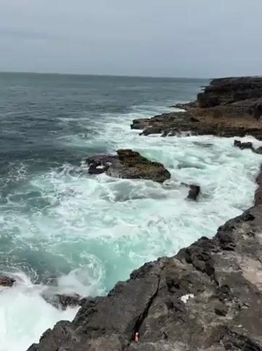 Powerful waves crash against rugged Cascais coastline