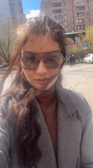Person in aviator sunglasses observed on Krasnogorsk sidewalk