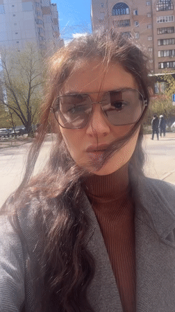 Person in aviator sunglasses observed on Krasnogorsk sidewalk