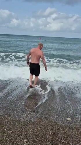 Man enjoys early morning swim at Alanya beach