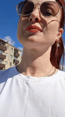 Woman films herself outdoors in sunny Смалявічы, Belarus
