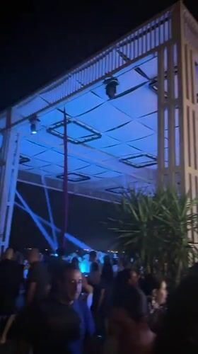 Aerial silk performances at a Burgas beach club after dark