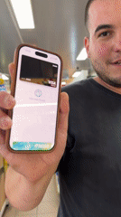 Customer makes contactless smartphone payment at Bulgarian store