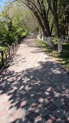 Sunny summer day across Tekeli's parks, streets, and river