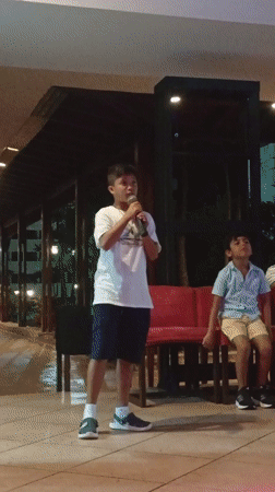 Young boy performs on stage in Juangriego, Venezuela