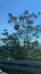 Vehicle passenger films scenic Montenegro mountain vista
