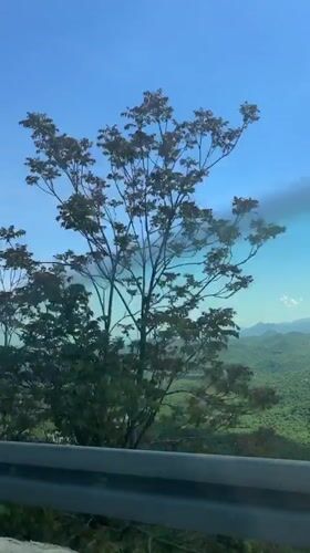 Vehicle passenger films scenic Montenegro mountain vista
