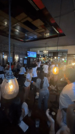 Pub erupts in celebration, Argentina jersey and all