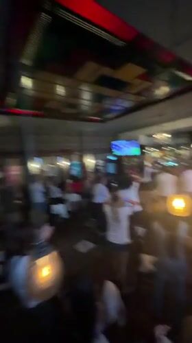 Pub erupts in celebration, Argentina jersey and all