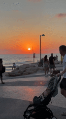 Tel Aviv's Mediterranean sunset draws a crowd to the shore