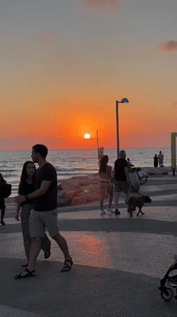 Tel Aviv's Mediterranean sunset draws a crowd to the shore