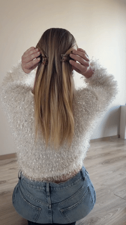 Woman styles hair, takes selfies in Dreiliņi home