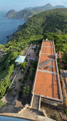 Hòa Xuân coastline seen from above, hills meet the sea