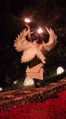 Angel-costumed fire dancer performs nighttime show in Blahbatuh, Indonesia