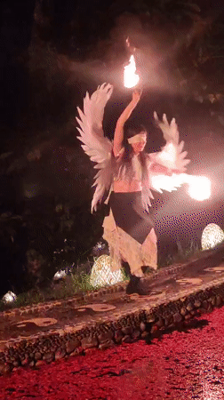 Angel-costumed fire dancer performs nighttime show in Blahbatuh, Indonesia