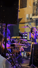 Outdoor night music set with drums and keys in Barcelona