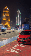 Nighttime street activity documented across central Kuala Lumpur