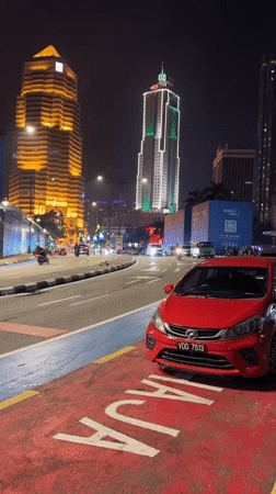 Nighttime street activity documented across central Kuala Lumpur