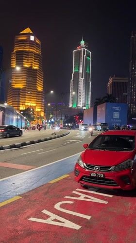 Nighttime street activity documented across central Kuala Lumpur