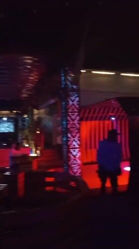 Nightlife scene at a lit-up lounge in Howayi, Nigeria