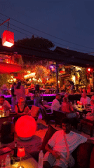 Evening dining scene at outdoor restaurant in Baan Sri Thanu