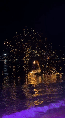 Fire performer creates spark display in water in Thailand