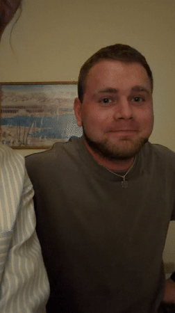 Man expresses shame, covers face in emotional moment