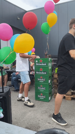 Casual summer gathering outside a modern building in Den Hoorn