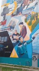 Spring afternoon captured in Tobolsk: mural, blooming tree, sleeping baby