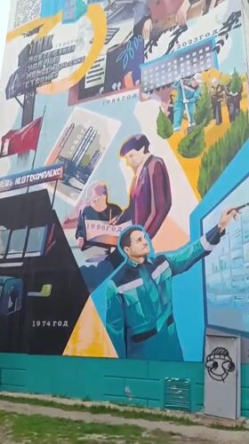 Spring afternoon captured in Tobolsk: mural, blooming tree, sleeping baby