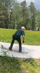 Artificial ski ramps set up on grassy slope for summer practice