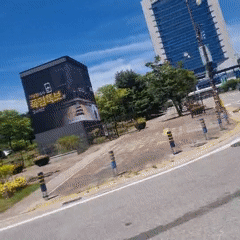 Driving through Gangneung past an Olympic landmark on a clear day
