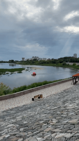 Witness documents Kurgan cityscape including river, sculpture, church