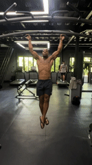 Man performs pull-ups at early morning gym session in Mengwi