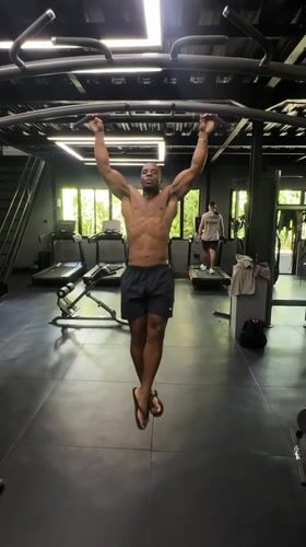 Man performs pull-ups at early morning gym session in Mengwi