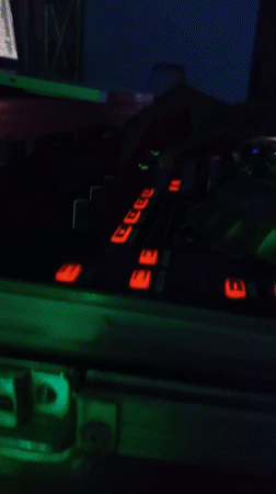 DJ performs evening set in Lokoja club with colored lighting