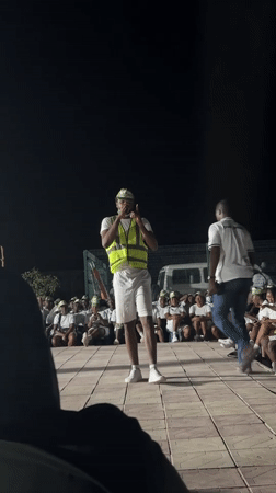 NYSC member performs for crowd in Maiduguri nighttime gathering
