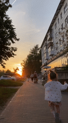 Afternoon life captured in Chaikovsky: children, pets, dandelions