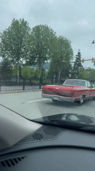 Vintage Chevrolet stops at Coquitlam intersection during afternoon traffic