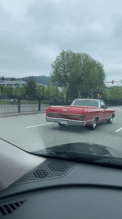 Vintage Chevrolet stops at Coquitlam intersection during afternoon traffic