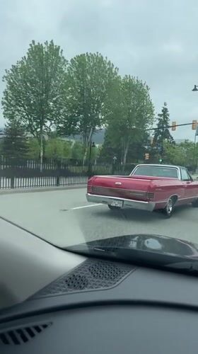 Vintage Chevrolet stops at Coquitlam intersection during afternoon traffic
