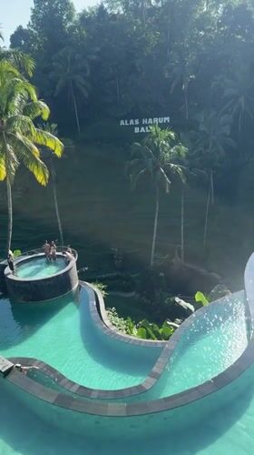Tourists enjoy pools and coffee tours at Bali agrotourism site
